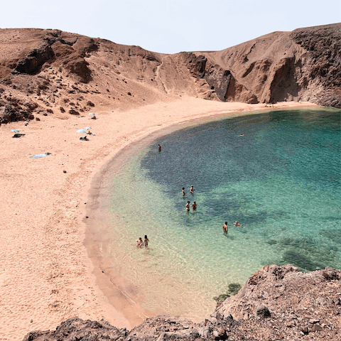 Visit the stunning beaches nearby, with golden sand and crystal-clear waters, framed by lava rock