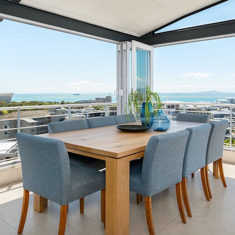 Enjoy dinner on the terrace with far-reaching ocean views