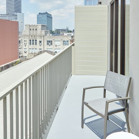 Get a taste of the city atmosphere from your open-air balcony