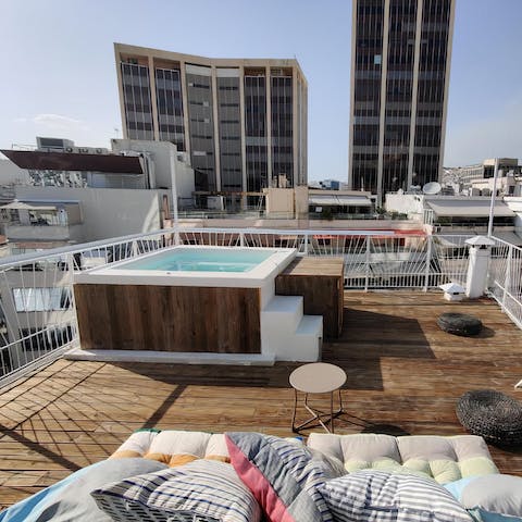 Have a soak in the hot tub on the rooftop terrace