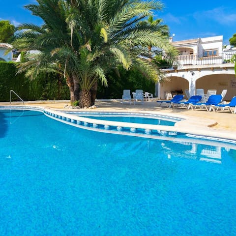 Make a splash in the communal pool as the sun shines bright in the afternoon