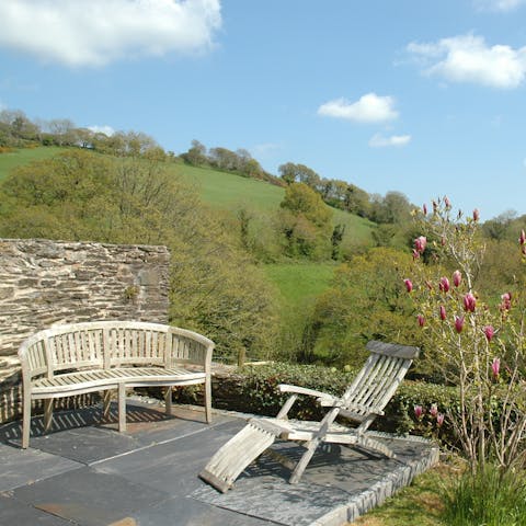 Find a spot on one of the patios to take in the Devonshire country views