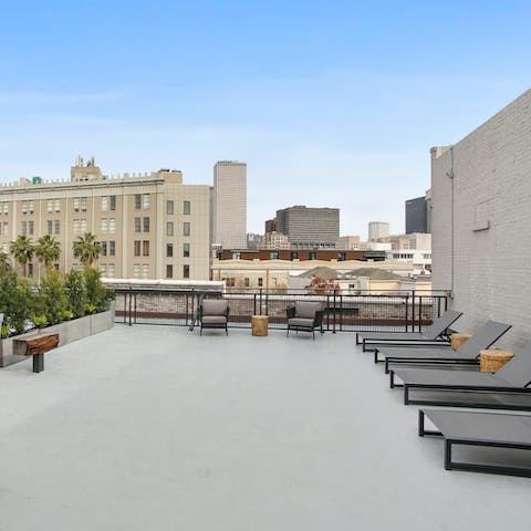 Unwind in the furnished rooftop garden and admire the city below