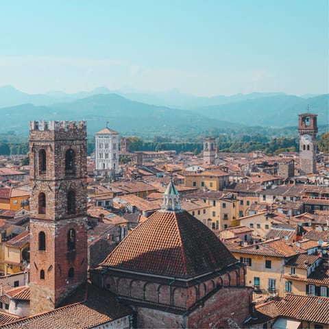 Walk the cobblestoned streets of Lucca, a twenty-minute drive away