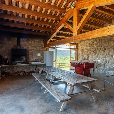 Host a lively barbecue in the barn-like games and dining room