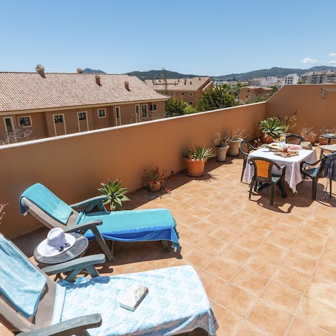 Laze on loungers in the sun on your private rooftop terrace