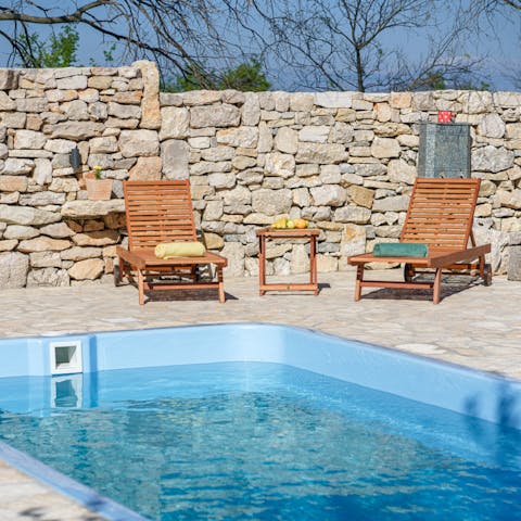 Relax with a good book by your private pool
