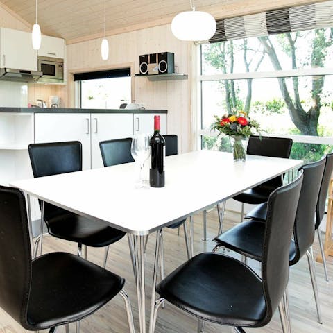 Share delicious meals with your family at the large dining table 