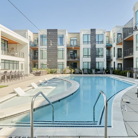 While away afternoons by the pool, splashing in the water and lounging on the chairs