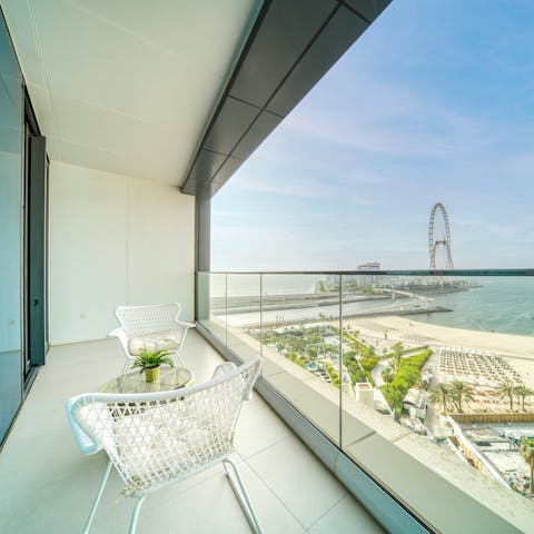 Take in views of Ain Dubai from the apartment's private balcony