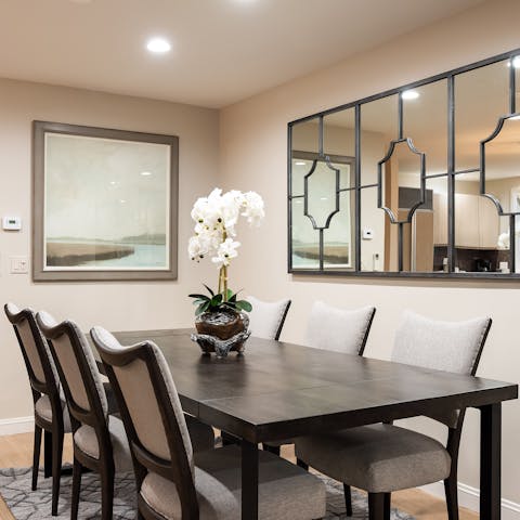 Dine in style by the dark wooden dining table 