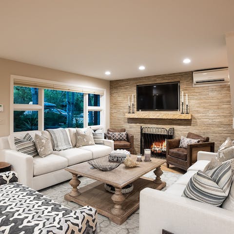 Cosy up by the fire in the elegant living room