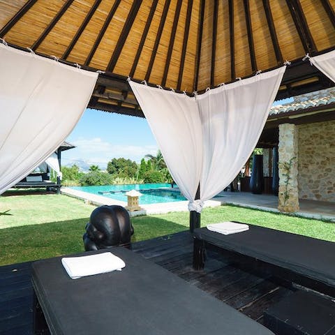 Arrange a private massage and make use of the poolside cabana