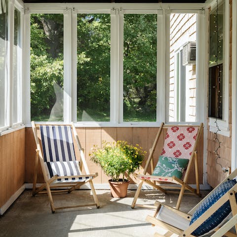 Sip a cocktail from a deckchair in the enclosed front porch