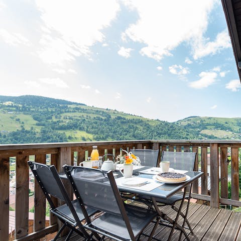 Enjoy breakfast with coffee and a spectacular view of the mountains