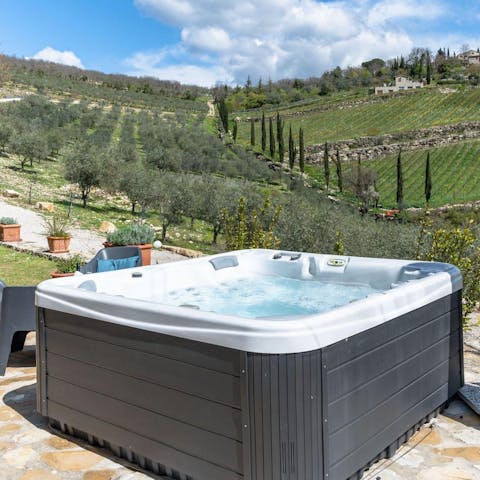 Soak in the hot tub while admiring the views