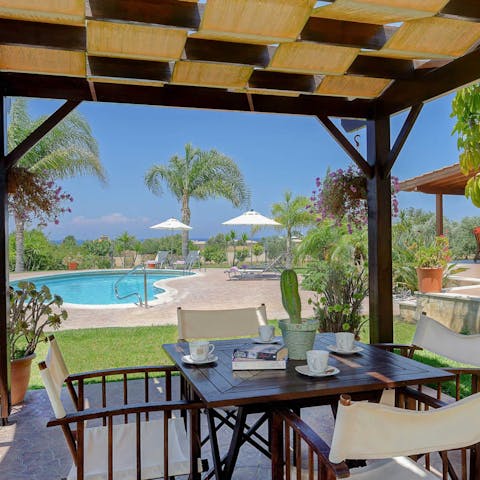 Enjoy an alfresco breakfast as the breeze rustles the palm trees