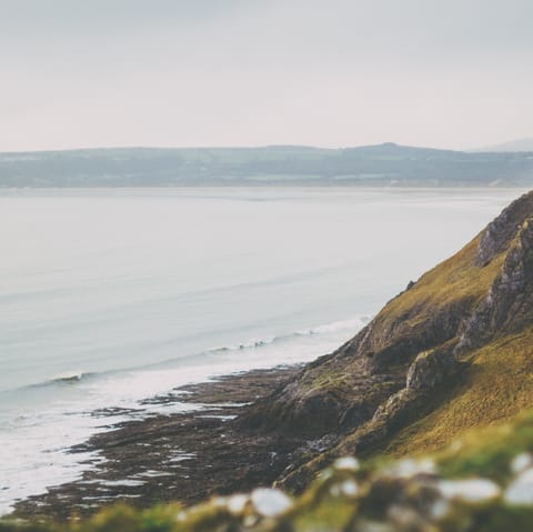 Experience the  wild beauty of the Gower Peninsula, with Llangennith beach just a mile-away