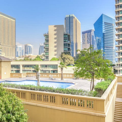 Swim in the communal pool to beat the Dubai heat