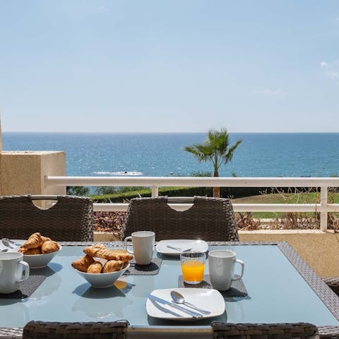 Indulge in breakfast pastries on the private balcony with sea views