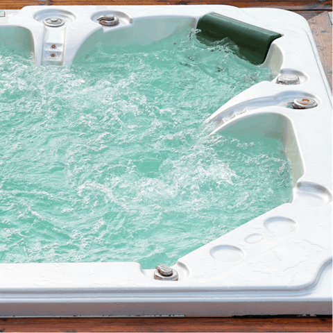 Soothe your tired muscles in the outdoor hot tub
