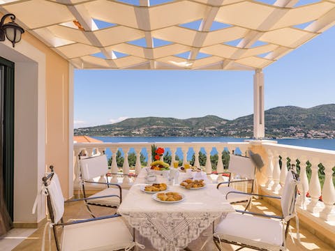 Look out over the bay as you dine on your private terrace