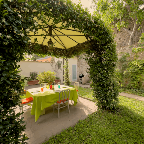 Dine alfresco in the shade of the jasmine arbour – there's a barbecue to cook on