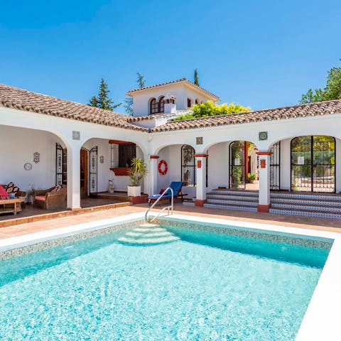 Swim laps in the pool in the quiet of the courtyard garden