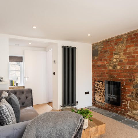 Gather around the LED fireplace and cosy up after a long beach walk
