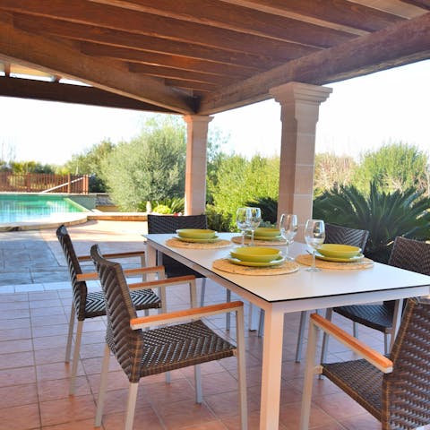 Dine alfresco while you enjoy the fresh air and lush Mediterranean garden
