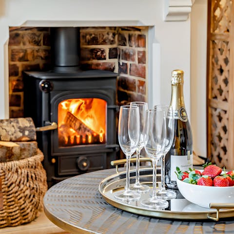 Open a bottle of fizz to enjoy in front of the fire