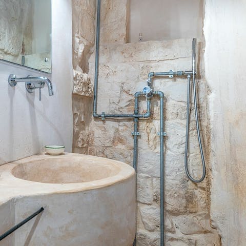 Freshen up in the stone surroundings of the unique bathrooms