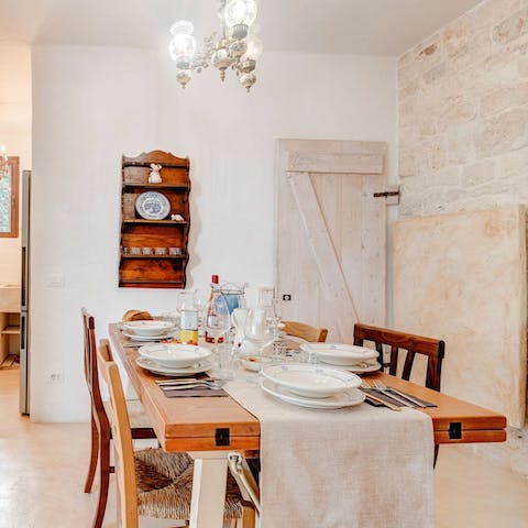 Serve up juicy olives and fresh bread in the rustic kitchen