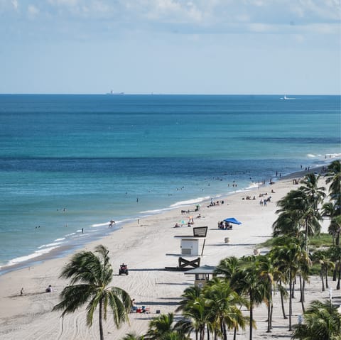 Stretch on Hollywood Beach's family-friendly white sands – just a short drive from home