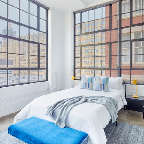 Wake up to views of the Philly skyline through the huge windows in the bedroom
