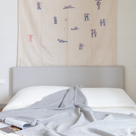Admire the dreamy wall hanging before falling asleep