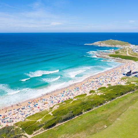 Stroll down to Fistral Beach – popular with sand and surfing lovers