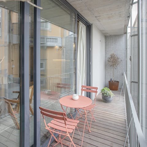 Sip your first cup of coffee on the charming balcony