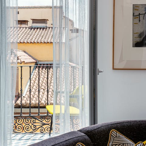 Sit out on your little balcony and take in views across the historic rooftops