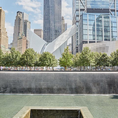 Take a contemplative moment at the nearby September 11 Memorial