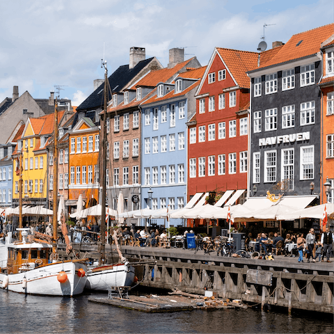 Hop on the nearby harbour bus down to Nyhavn, just a short ride away