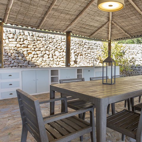 Cook something tasty in the outdoor kitchen dining area