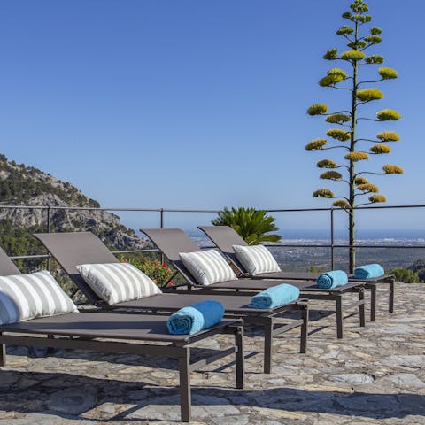 Relax and unwind on one of the comfortable sun loungers