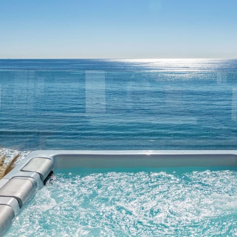 Listen to the sounds of the waves and watch the sunset in the hot tub