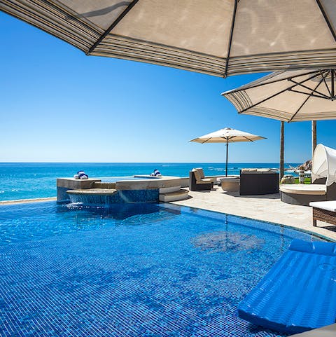 Take a dip in the glistening infinity pool