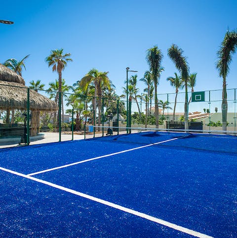 Don your finest whites on the beachfront tennis court