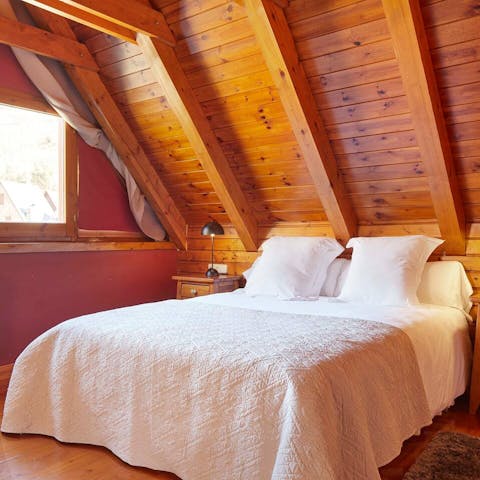 Wooden walls and ceilings give the feeling of a luxury lodge