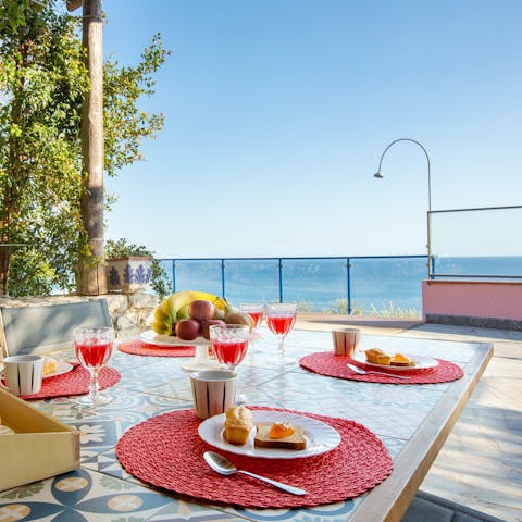 Admire the Mediterranean Sea views over breakfast on the terrace