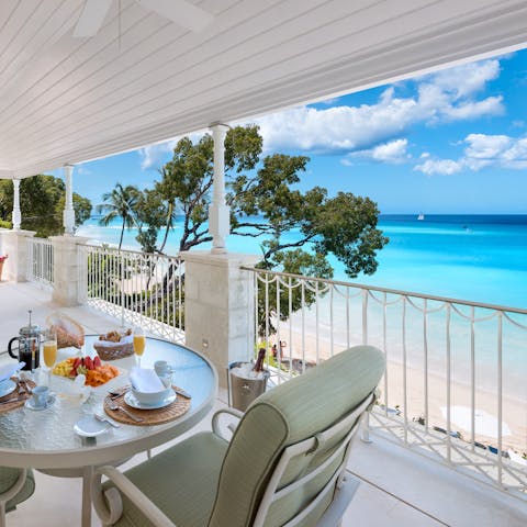 Look out to the crystal-clear sea from one of your many balconies