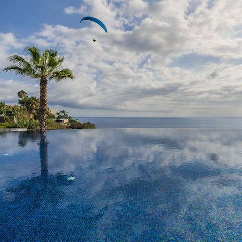 Cool off with a refreshing dip in the infinity pool after a day at the beach